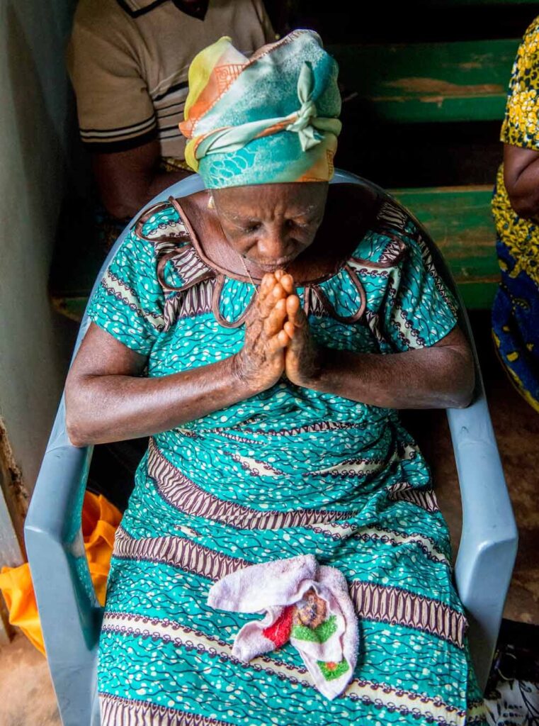 Woman prays at church.