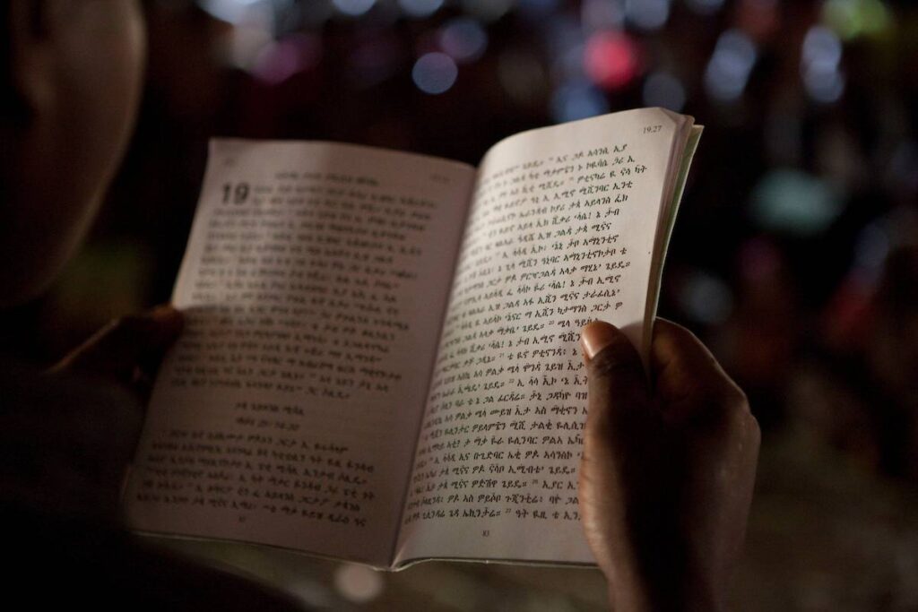 Woman holding and reading Scripture.
