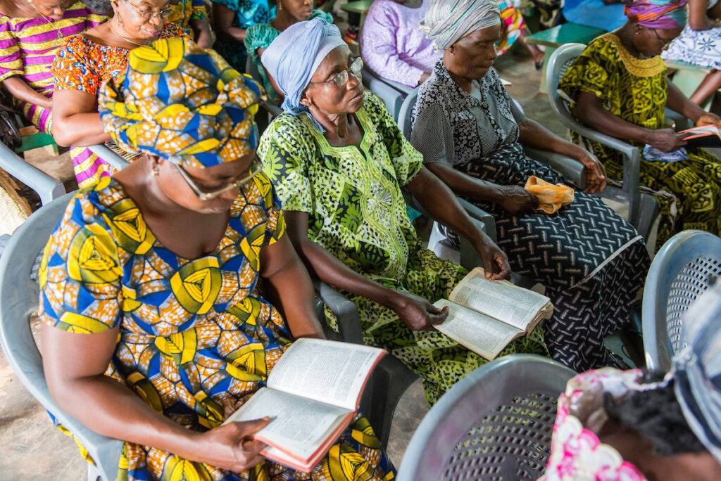 Women reading Scripture in church.