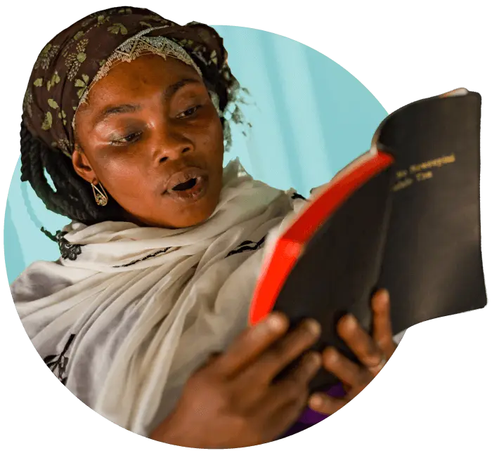 Africa woman reads Scripture out loud