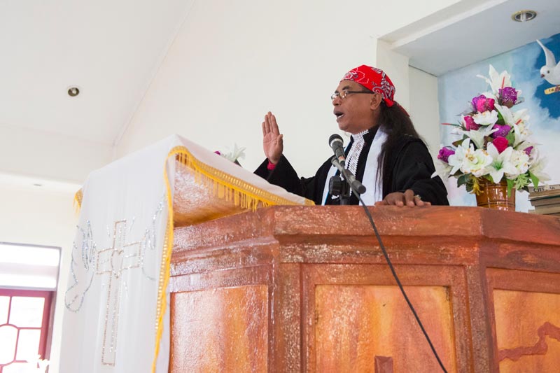 Person preaching in an Ambonese church.