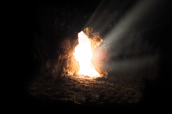 An empty tomb at sunrise.