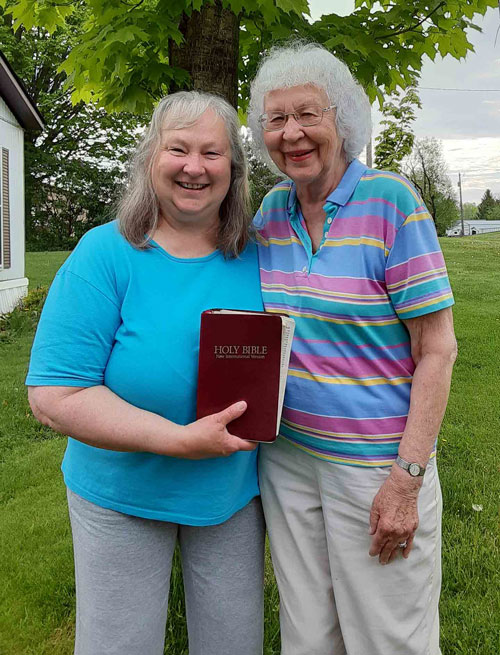Michelle with her mom with her grandmother’s Bible.