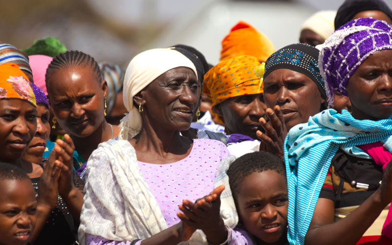 woman clapping at New Testament dedication for the Burunge