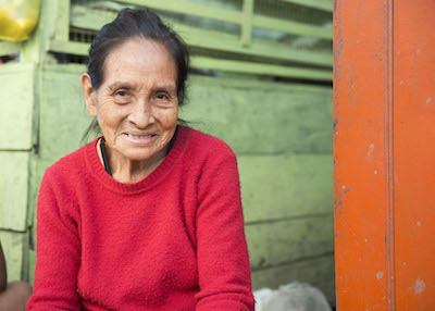 Elderly woman blessed by literacy training.