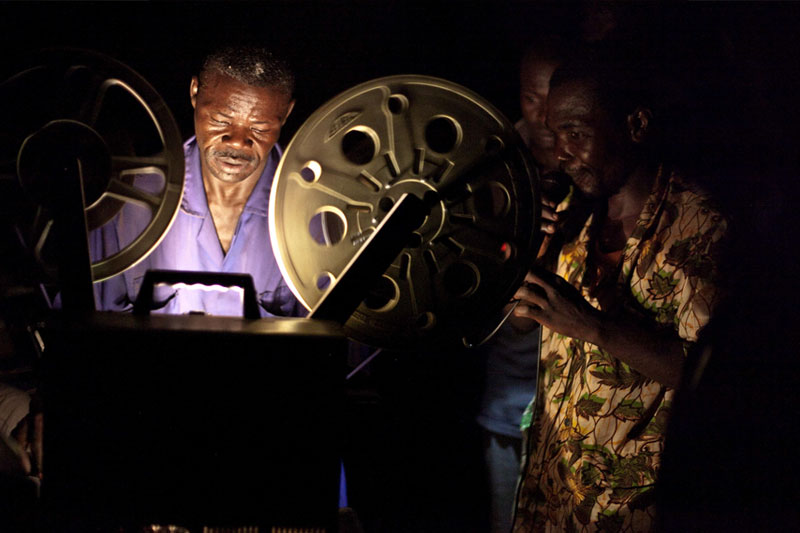 Loading the JESUS film showing onto the projector.