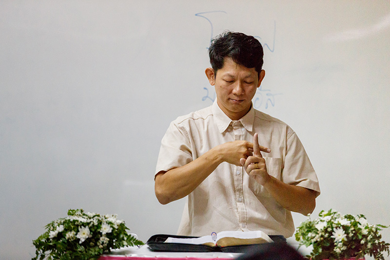 Pastor Montri preaching