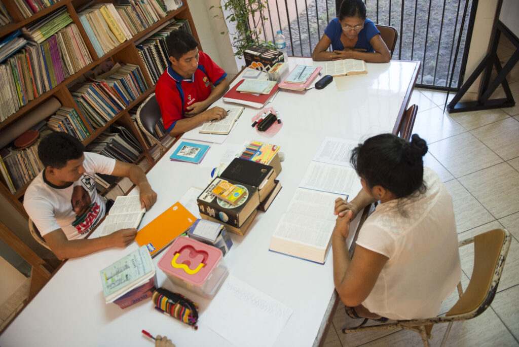 Birdseye view of the translation team working around a table