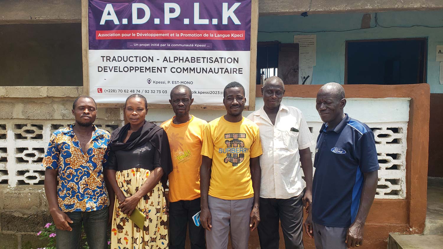 Remote members of the Kpeci translation team visit the office.