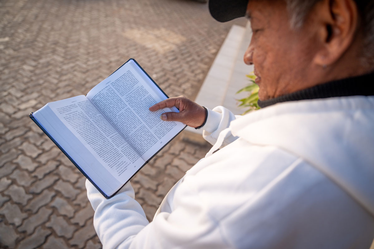 /></figure>
<p>The dedication of the Sihanaka Bible marks the beginning of even greater work ahead: The church in Madagascar is <strong>launching eight new translation projects</strong>, engaging with more communities to bring God’s Word to them. This global movement is only possible through the collaboration of churches, organizations and communities.</p>
<p>Serge Razafinjatoniary, associate area director for SIL Anglo-Lusophone Africa, emphasized the significance of these various churches and organizations working together: “Partnership is not ‘plan B,’ partnership is ‘plan A.’”</p>
<p>This spirit of collaboration is <a href= Man reading the Sihanaka Bible.