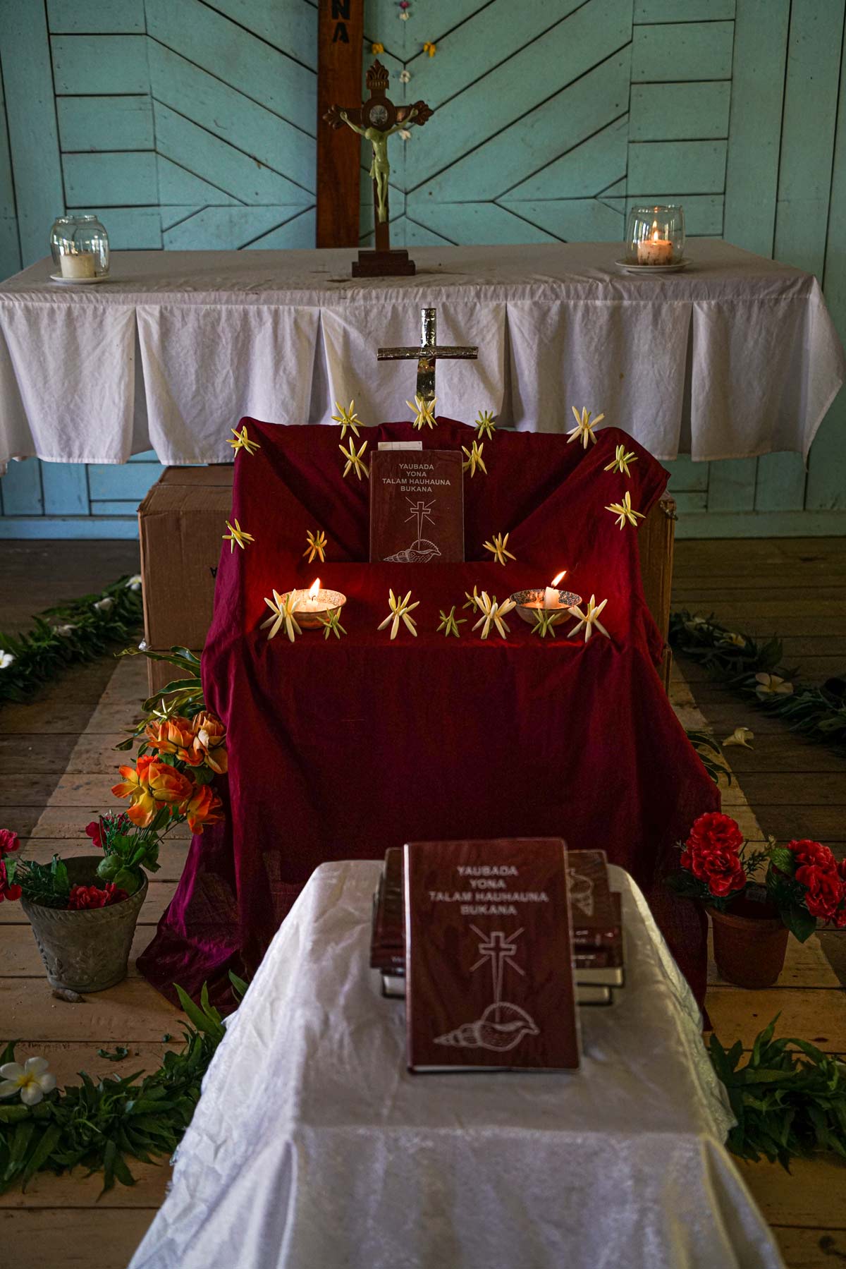 /></figure>
<p>In their speeches, the speakers promised to use the Saliba New Testament from now on in all church services and other activities. One speaker even encouraged the people to write songs about anything they learned from reading the New Testament.</p>
<p>When it was time for the final speech, a group of men carried a heavily decorated traditional platform filled with some local food items and two live chickens and presented it to the SIL (our primary partner) advisors. It was the traditional way of showing their utmost gratitude.</p>
<h3>The Word Takes Root</h3>
<p>During all three celebration days, people’s joy over the Saliba New Testament was palpable.</p>
<aside class= A special throne covered in burgundy velvet had been prepared for the Saliba New Testament.
