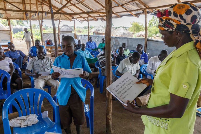 Neema A’dilo leads a literacy workshop in the Bidi Bidi
                                refugee settlement.