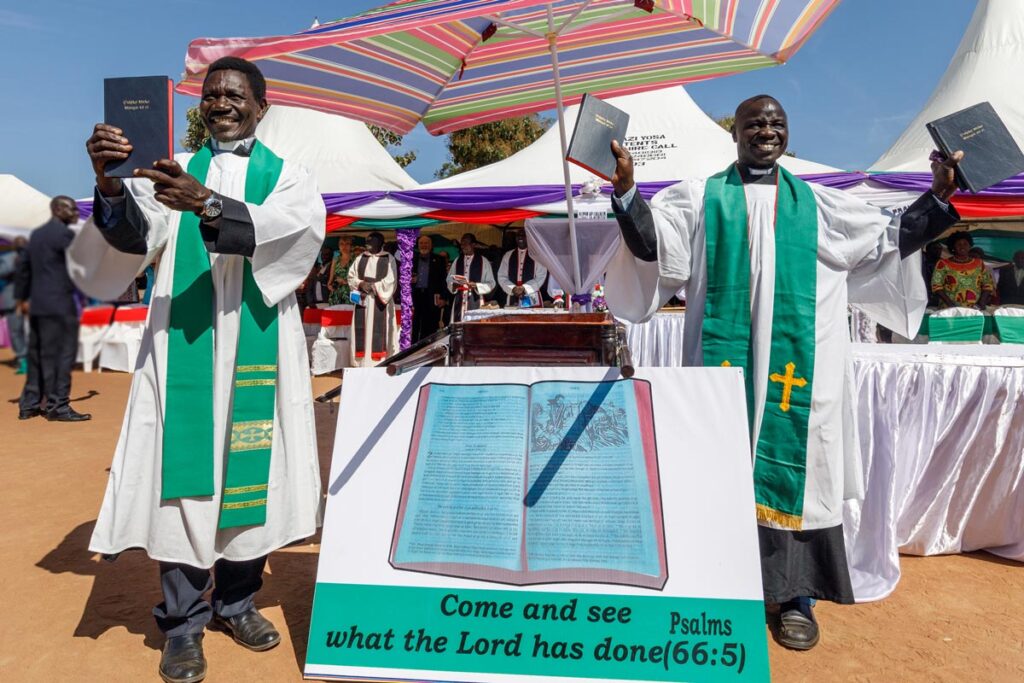 Keliko translators show published New Testaments.