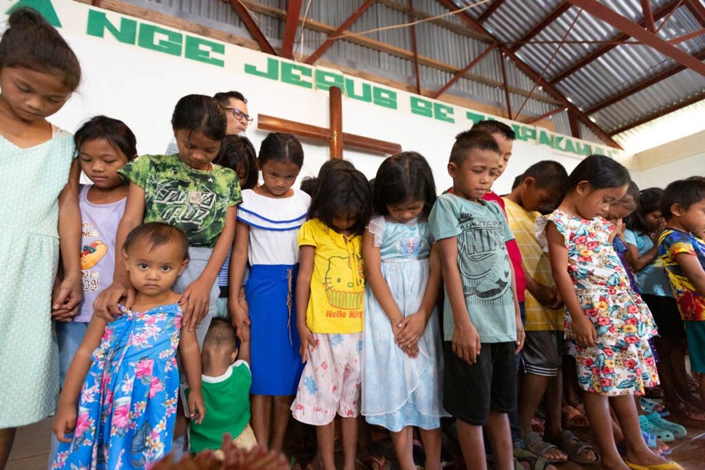 Young Isnag children are prayed over as part of the dedication. 
