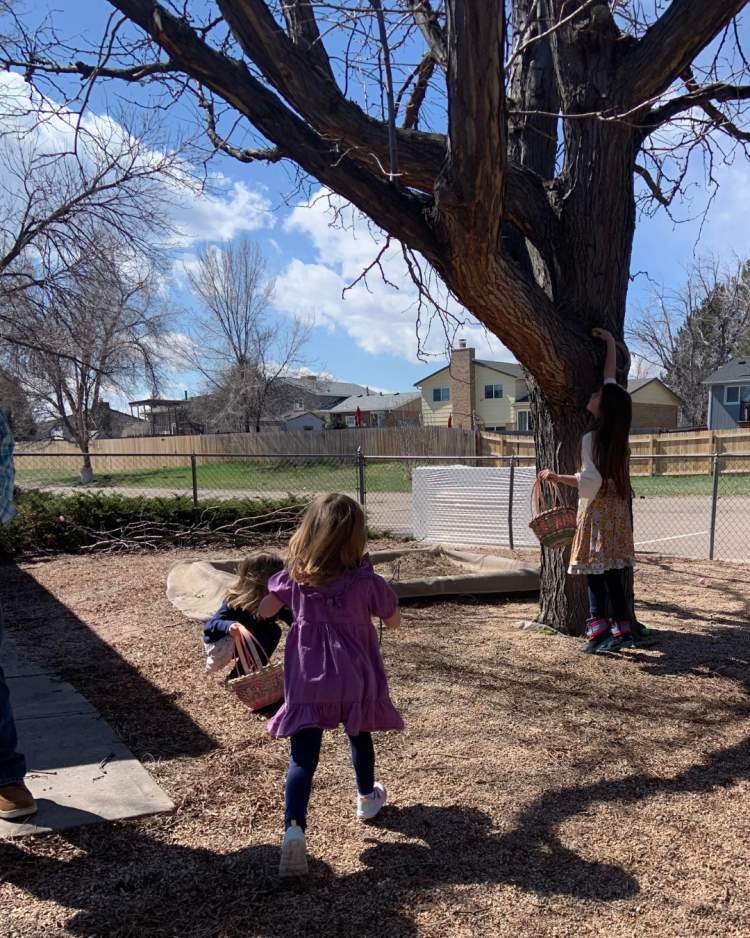 Children hunt for chocolate lambs in the Easter eggs during Calvary West Littleton’s Easter Bible translation activity.