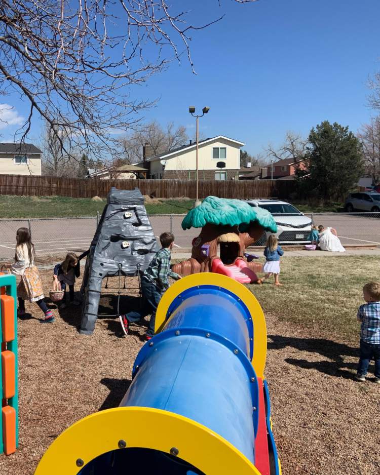 Several girls looking for Easter eggs.