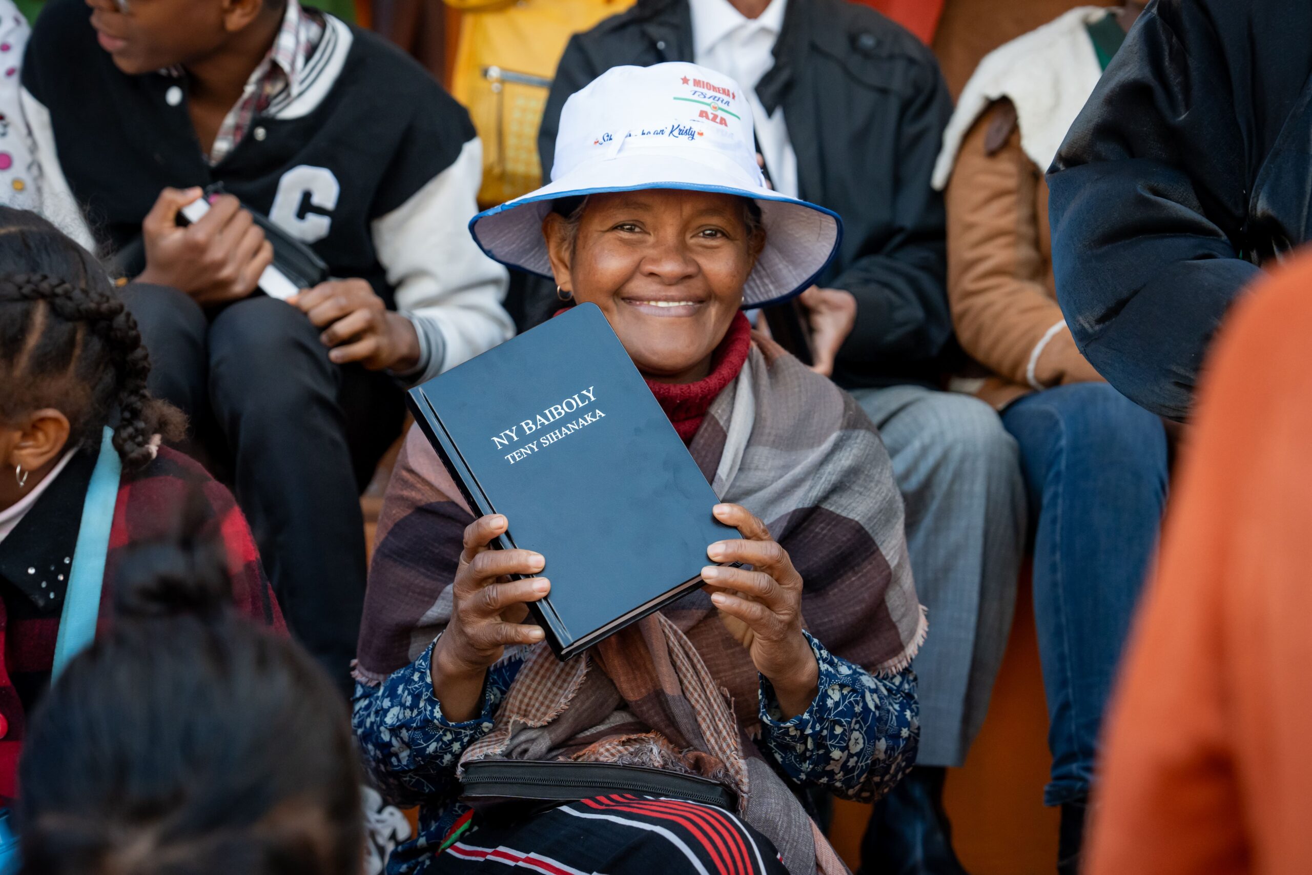 Woman holding a Bible in Madagascar.