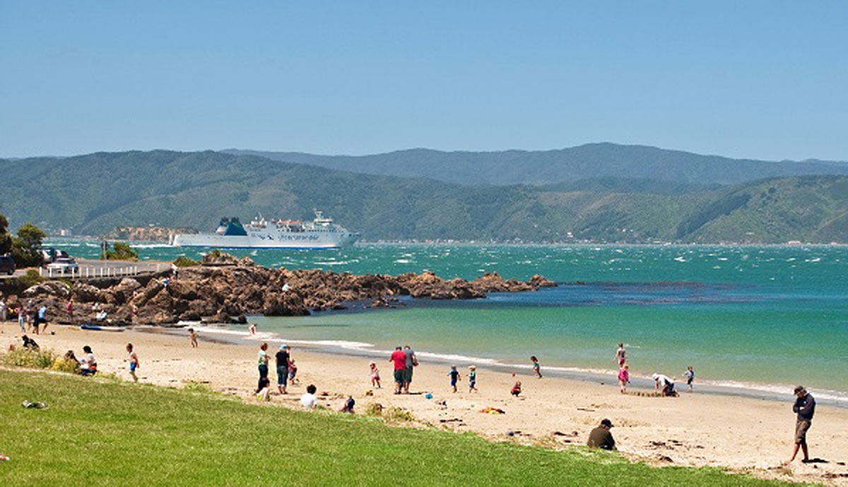 People on the beach in New Zealand