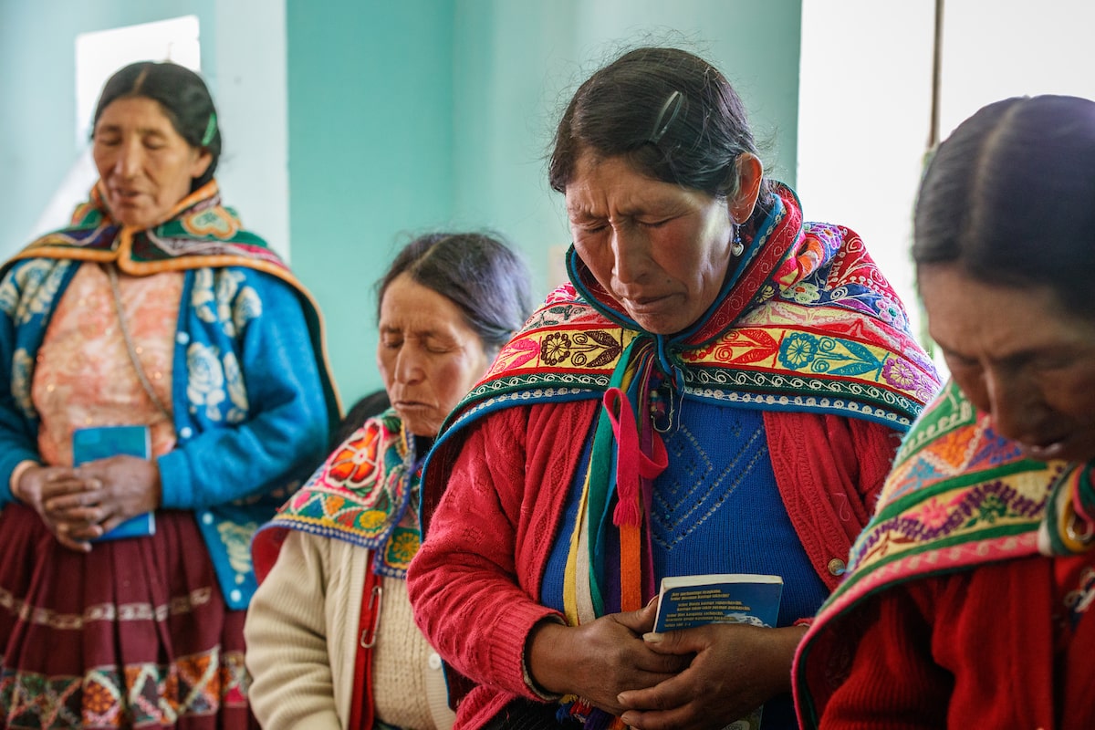 woman prays at church