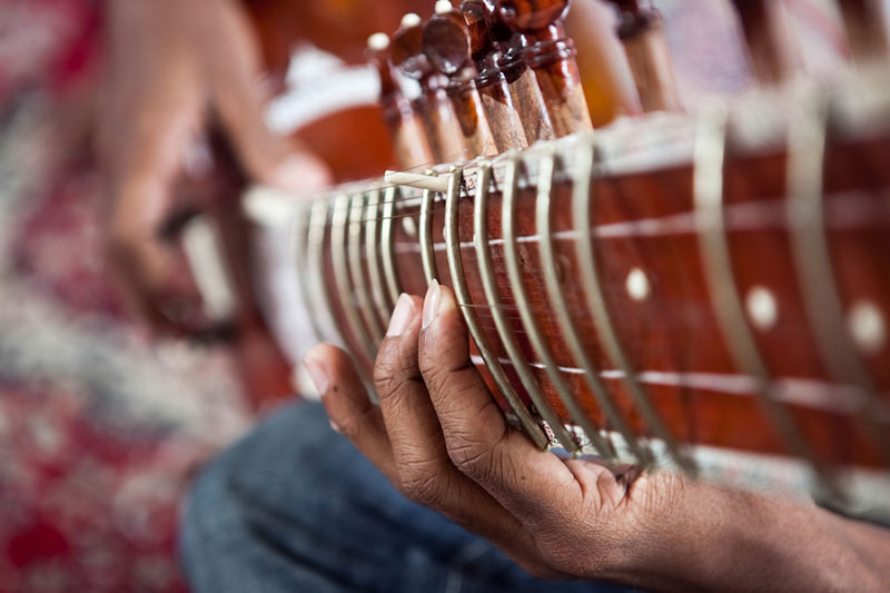/></figure>
<aside class= person playing guitar