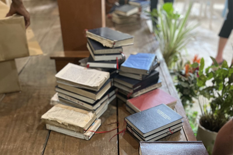 Well-worn New Testaments are traded in for the new Isnag Bible