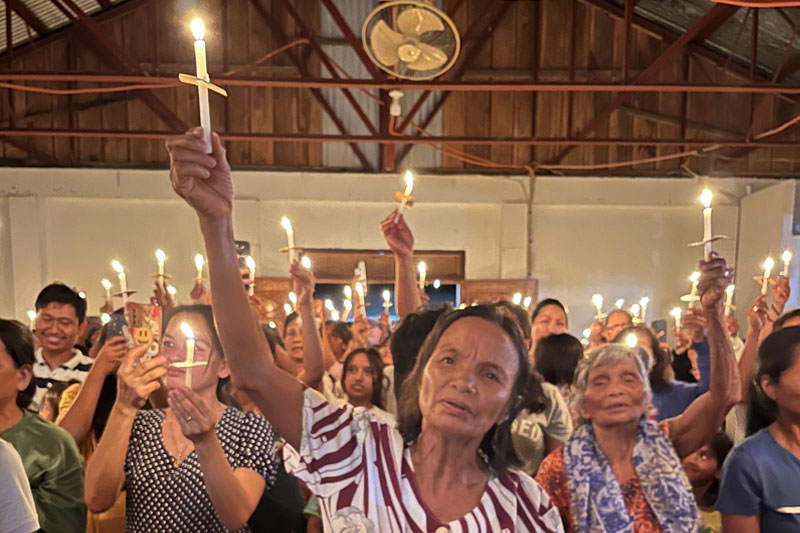 Isnag Bible dedication candlelight service.