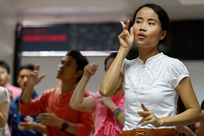 Woman signing Scripture.