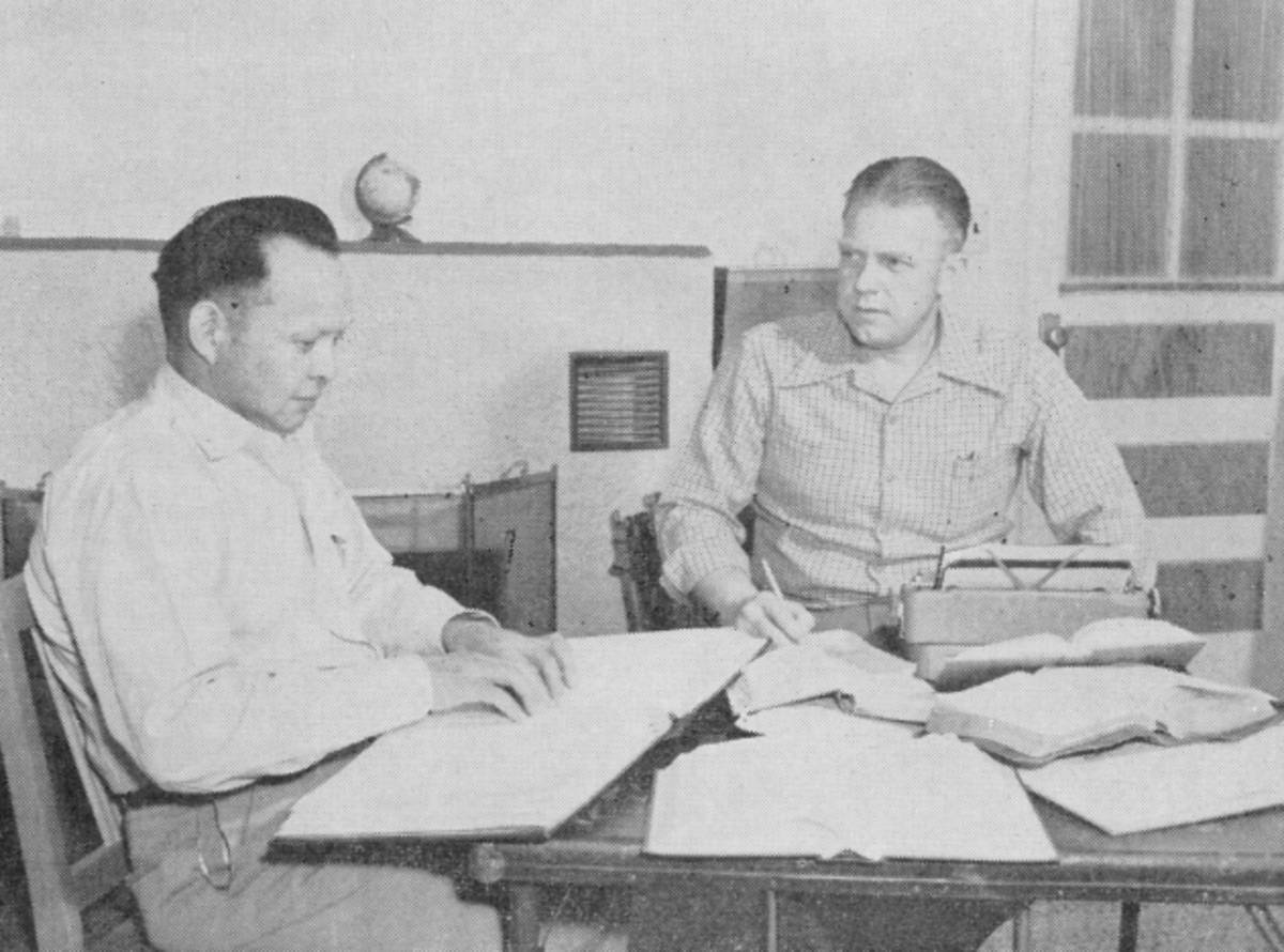 Turner Blount and a Navajo Christian leader making first draft of the Navajo New Testament.