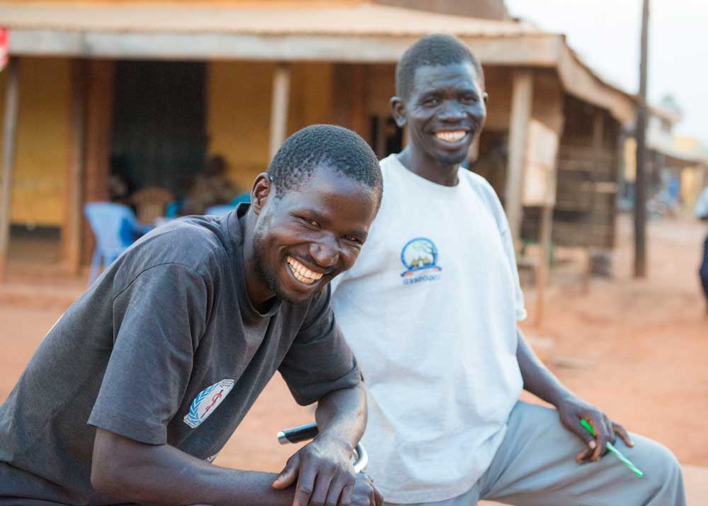 Two laughing men in the village