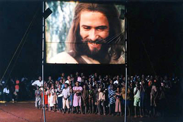 People from nearby villages gather to watch the JESUS film.