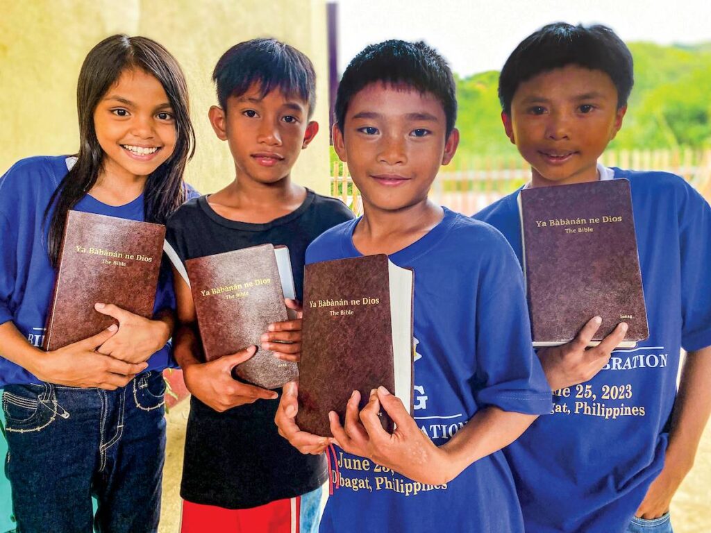 Children at the Isnag Bible dedication holding Bibles.