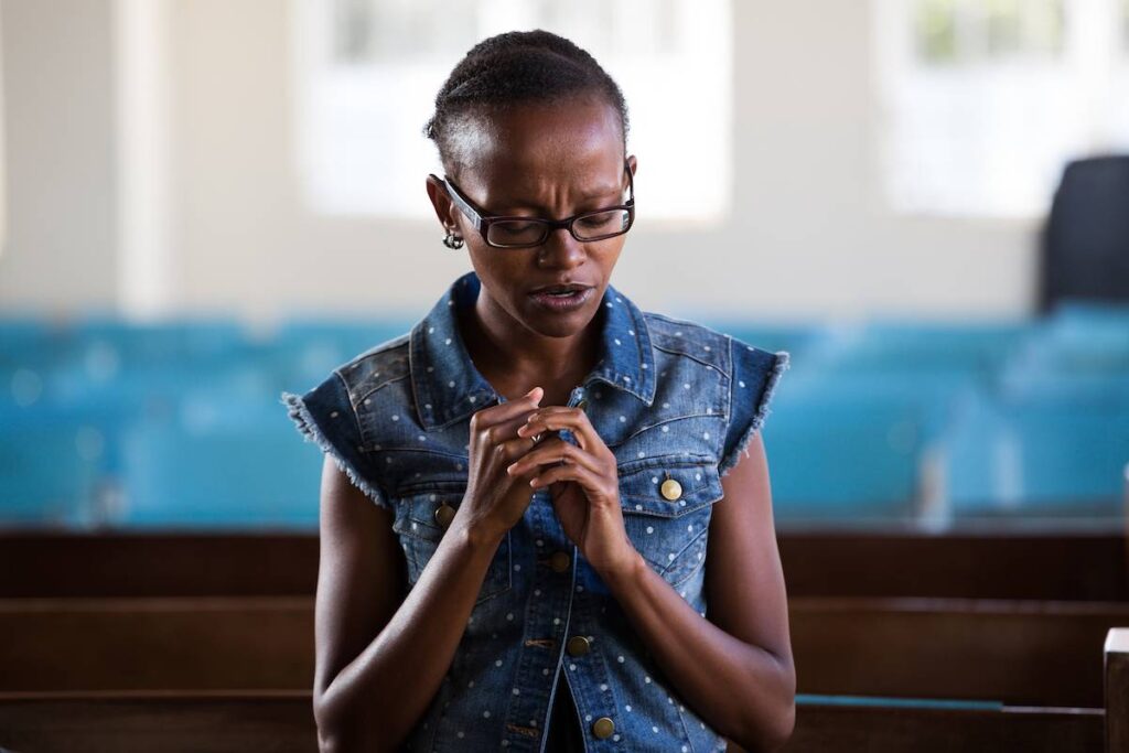 Woman in Kenya worshipping.