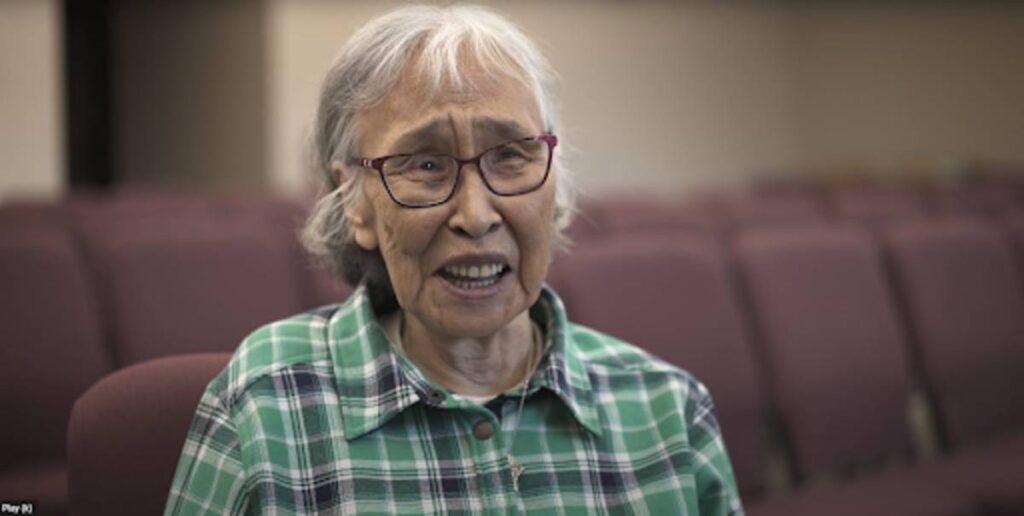 Beulah smiles at the camera.