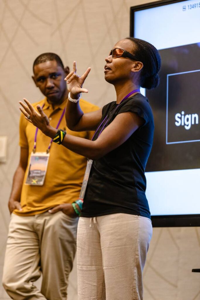 Woman signing with translator.
