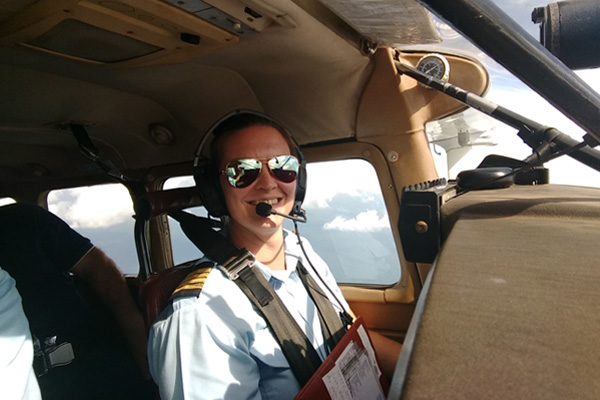 Rachel piloting a small aircraft.