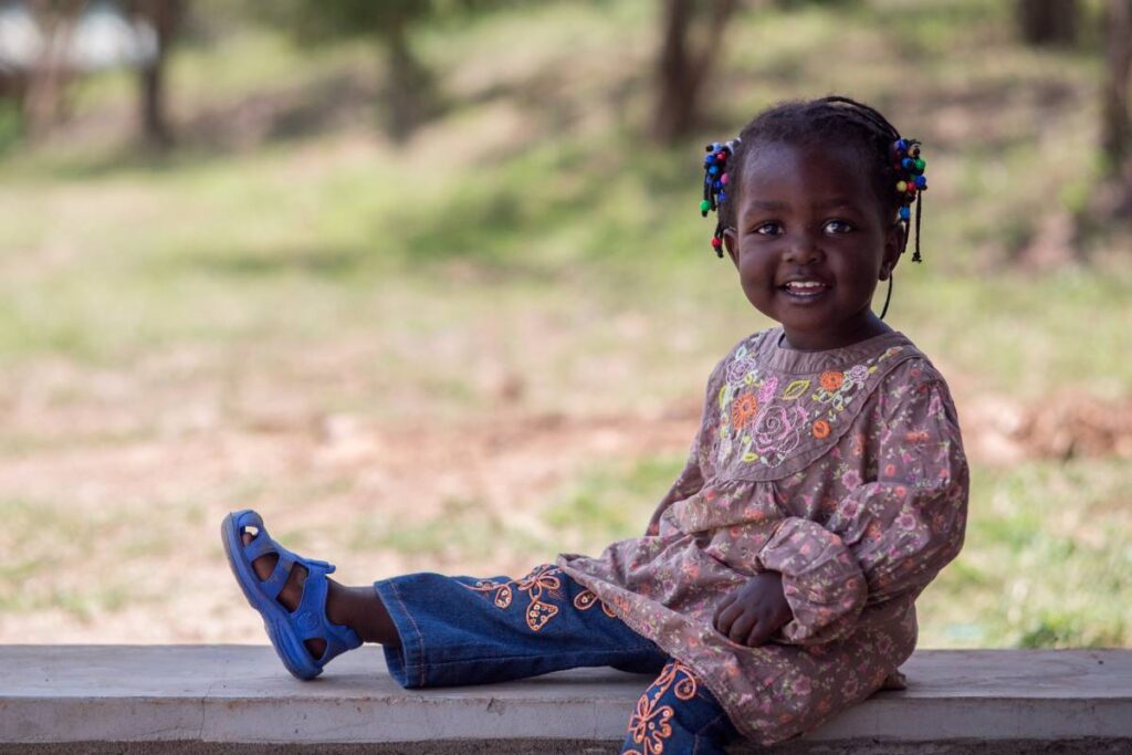 Young girl from Kenya smiling.