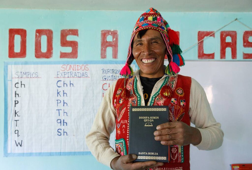 Peruvian man holding a Bible.