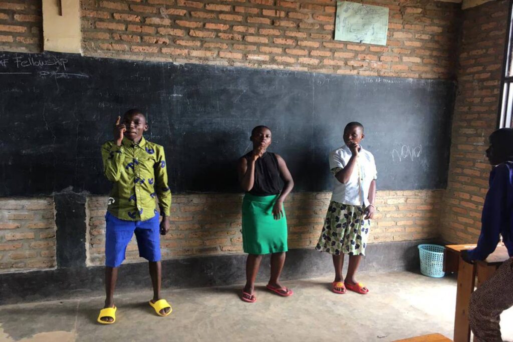 Three members of the Rwandan Sign Language team.